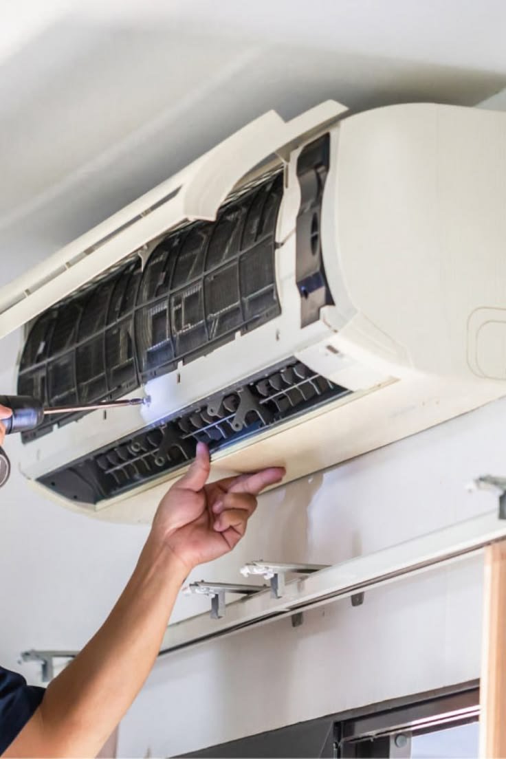 Weather Cool technician servicing an air conditioning unit
